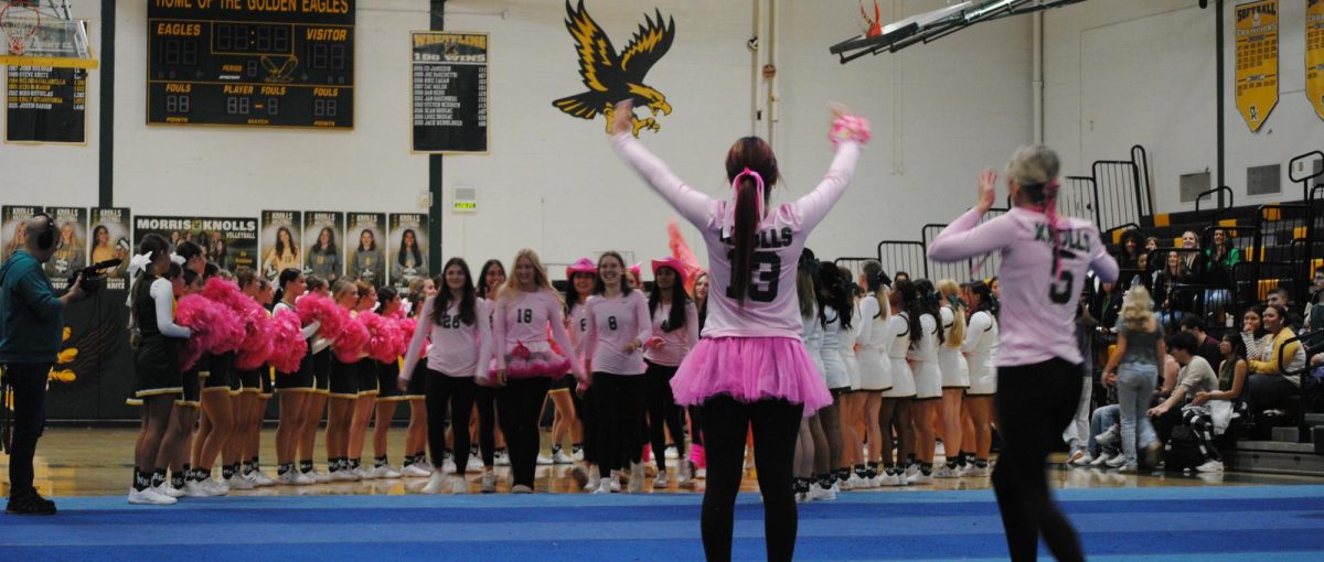 The Morris Knolls Varsity Volleyball squad enters the fall pep rally with lots of school spirt and enthusiasm!