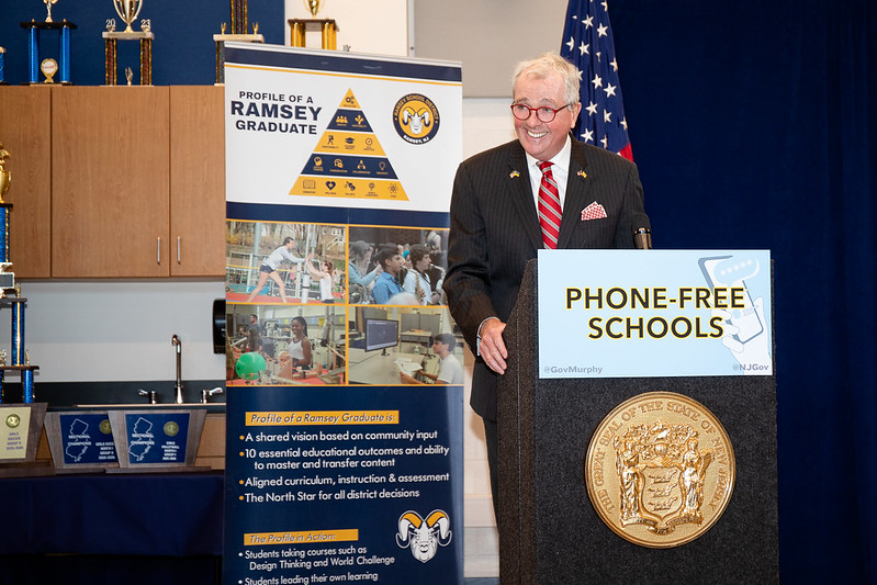 Governor Murphy signs new cell phone policy into law.  Photo courtesy of https://newjerseymonitor.com/2026/01/08/new-jersey-banning-cellphones-classroom/