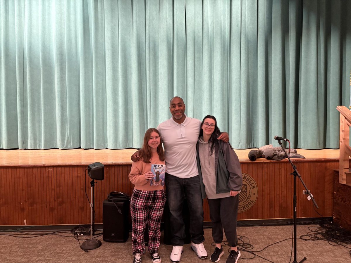 Cornell Thomas with students Robyn Seltzer and Emma Plaskow. Plaskow shared, “His message was very clear, he had a good way with speaking and connecting."